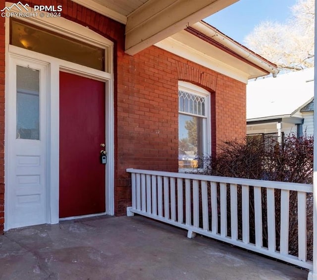 doorway to property featuring covered porch