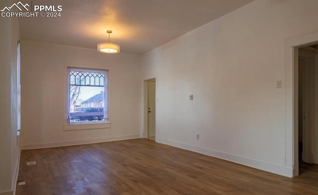 spare room featuring hardwood / wood-style flooring