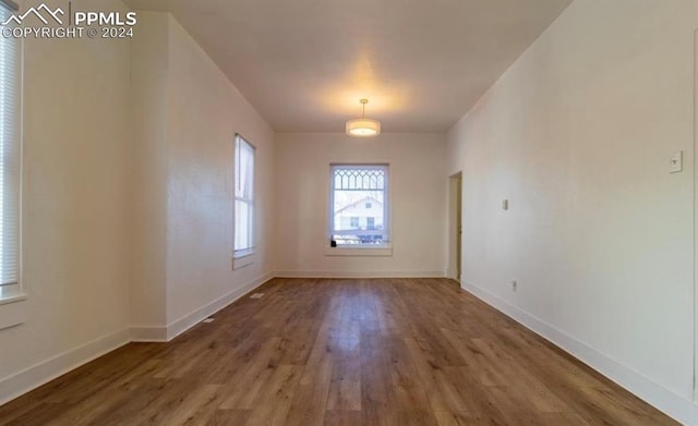 spare room featuring hardwood / wood-style flooring