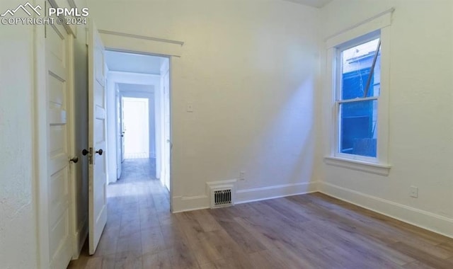 empty room featuring hardwood / wood-style flooring