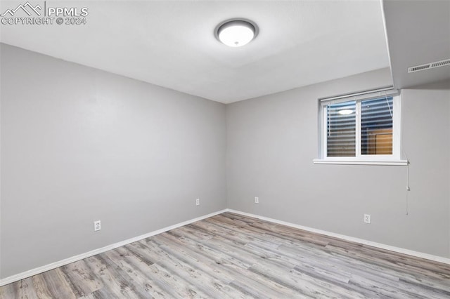 spare room featuring light wood-type flooring