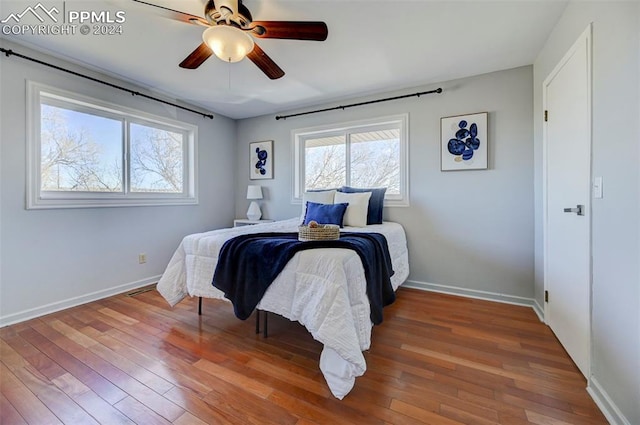 bedroom featuring ceiling fan and wood-type flooring