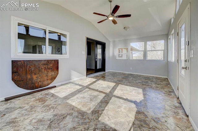 foyer with ceiling fan and lofted ceiling