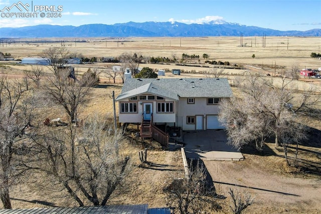 bird's eye view featuring a mountain view and a rural view