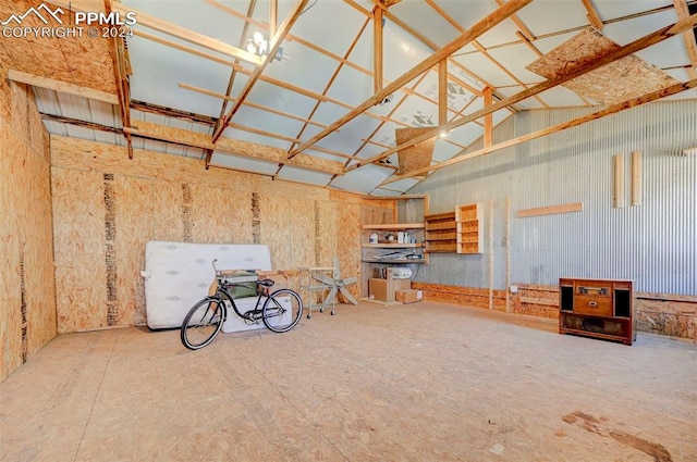 miscellaneous room featuring high vaulted ceiling