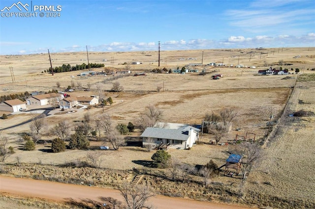 birds eye view of property featuring a rural view