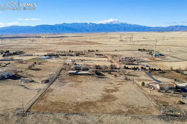 bird's eye view with a mountain view and a rural view