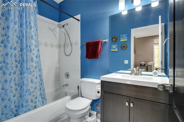 full bathroom featuring shower / tub combo with curtain, vanity, and toilet