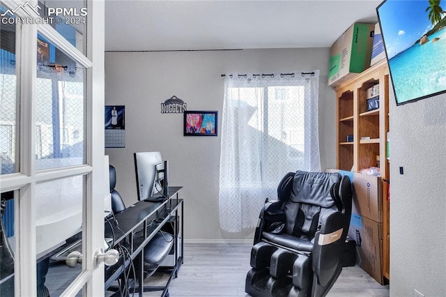 office featuring light wood-type flooring and french doors