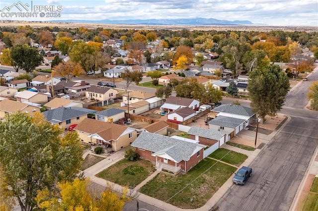 birds eye view of property featuring a mountain view