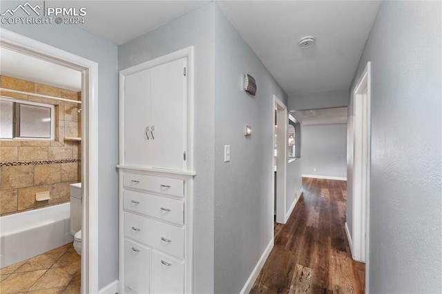 hall with dark hardwood / wood-style floors