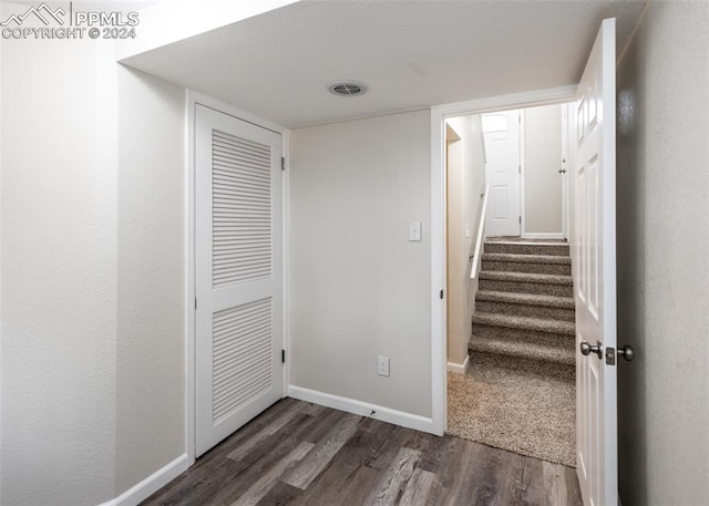 corridor with dark hardwood / wood-style floors