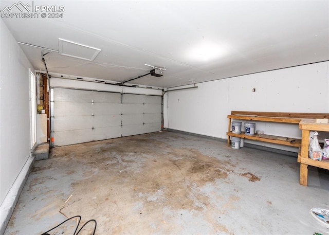 garage featuring a workshop area and a garage door opener