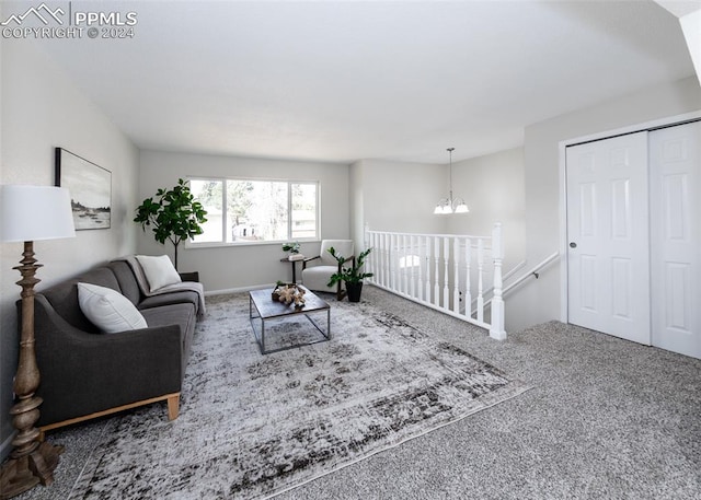 living room featuring a chandelier and carpet flooring