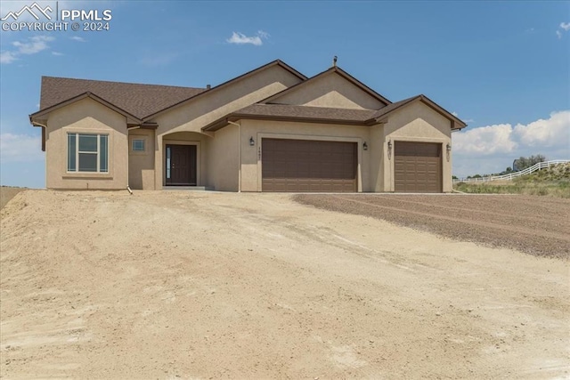 single story home with a garage