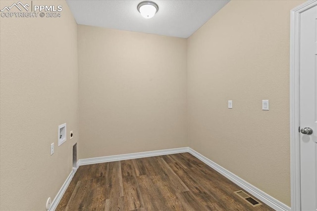 clothes washing area featuring hookup for an electric dryer, washer hookup, and dark hardwood / wood-style floors