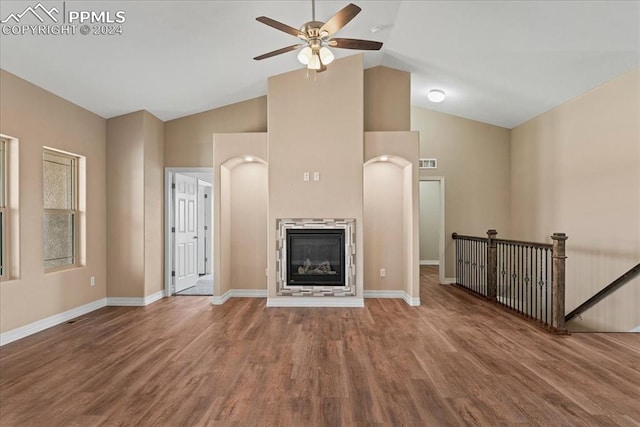 unfurnished living room with high vaulted ceiling, hardwood / wood-style flooring, and ceiling fan