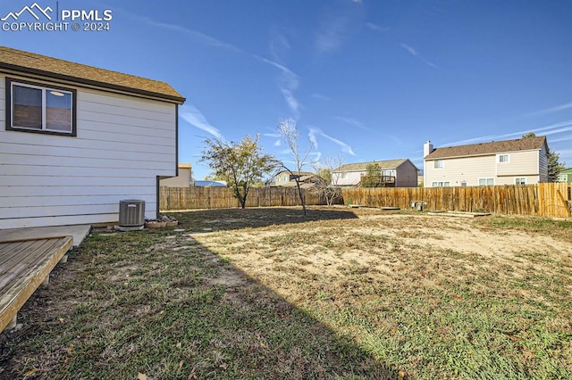 view of yard with central AC unit