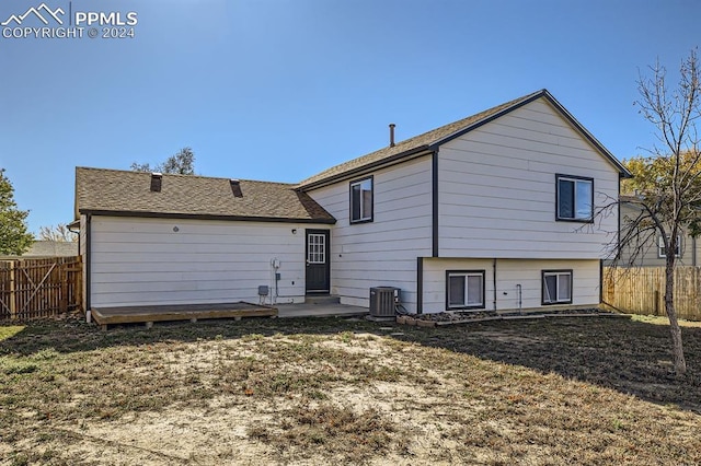 966 Daffodil St, Fountain, CO 80817 - rear view of property with cooling unit, a shingled roof, and a patio