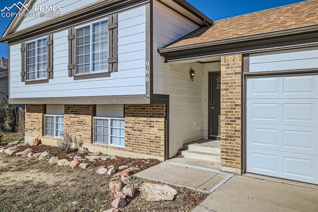 966 Daffodil St, Fountain, CO 80817 - view of exterior entry featuring brick siding and a shingled roof