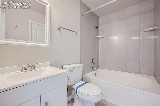 full bathroom with vanity, tiled shower / bath, and toilet