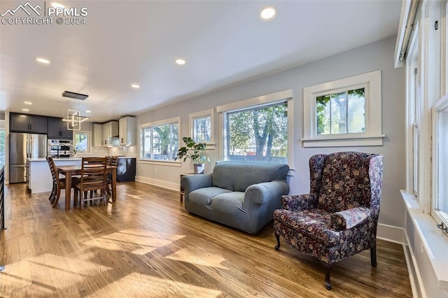 living room with light hardwood / wood-style flooring