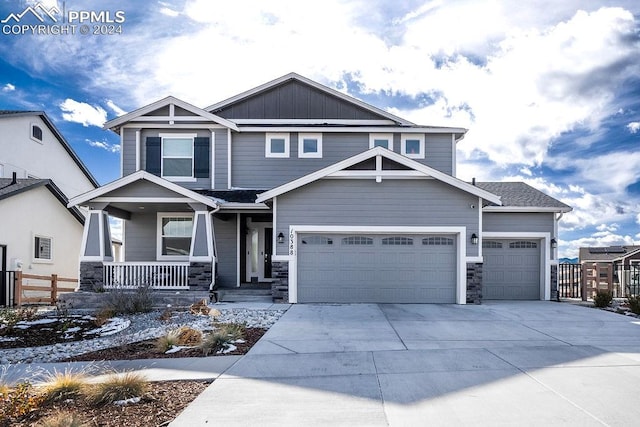 craftsman inspired home featuring a porch and a garage