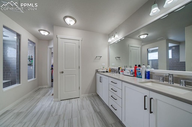 bathroom featuring vanity and a textured ceiling