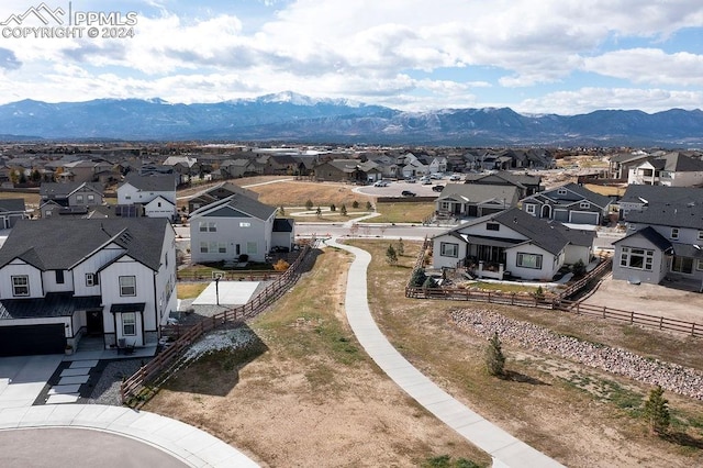 birds eye view of property with a mountain view