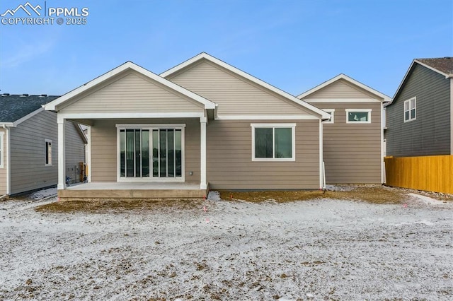 rear view of property with a patio area and fence