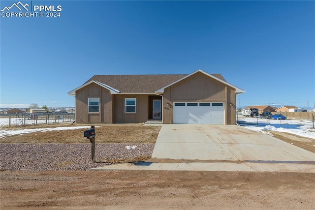 single story home with a garage