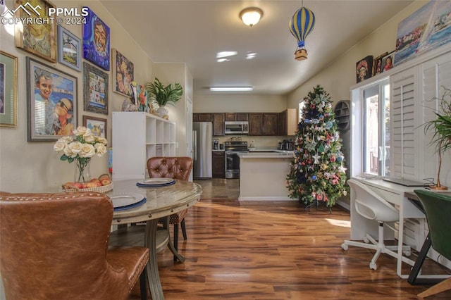 dining area featuring dark hardwood / wood-style flooring