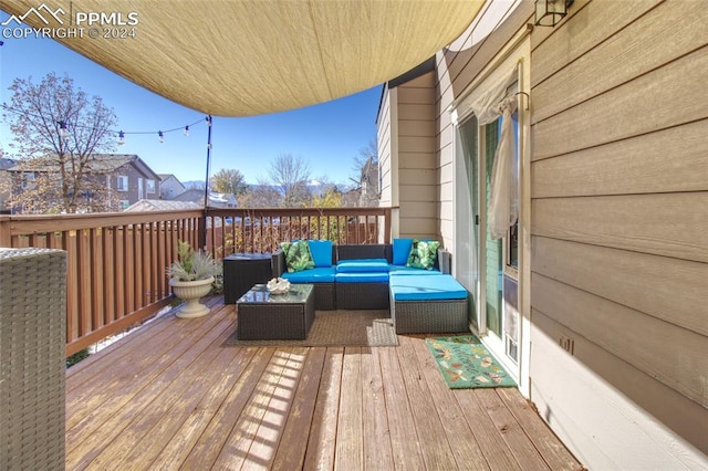 wooden terrace featuring an outdoor hangout area