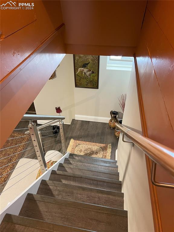 822 Willow St, Trinidad, CO 81082 - stairway with wood finished floors and baseboards