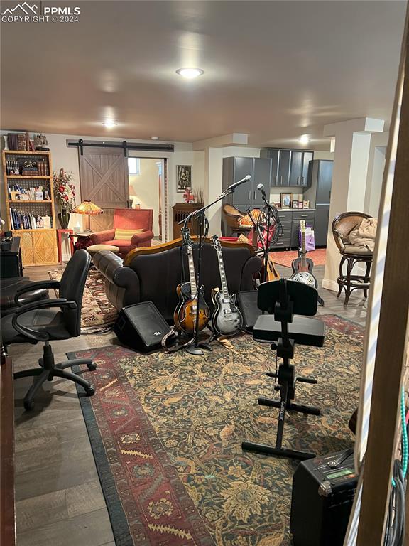 822 Willow St, Trinidad, CO 81082 - living area featuring a barn door and an office area