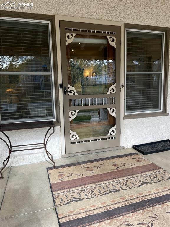 822 Willow St, Trinidad, CO 81082 - view of exterior entry featuring a porch and stucco siding