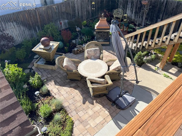 view of patio / terrace featuring a fireplace