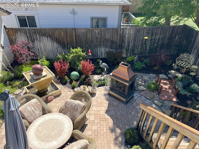 view of patio featuring a fireplace