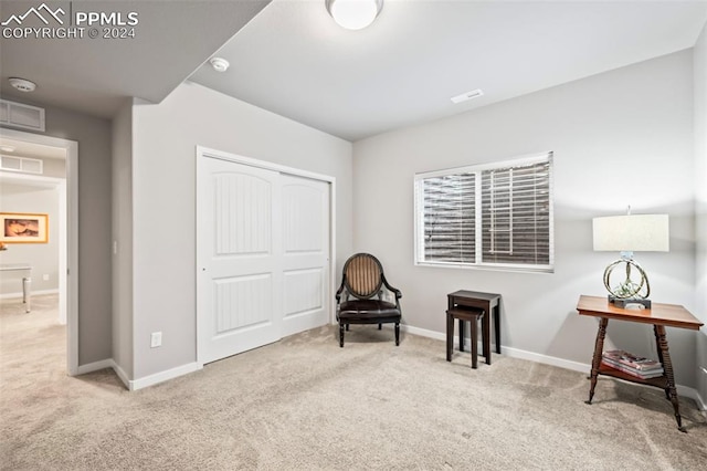 sitting room with light carpet