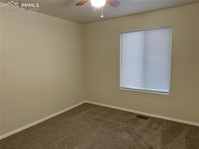 carpeted empty room with ceiling fan