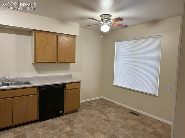 kitchen featuring ceiling fan, sink, and black dishwasher