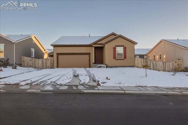 single story home with a garage