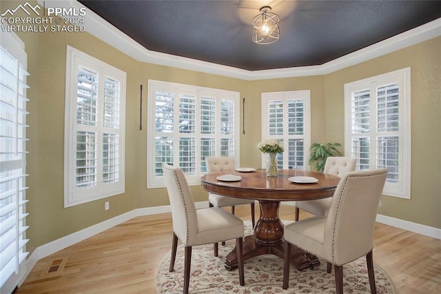 dining space with light hardwood / wood-style floors