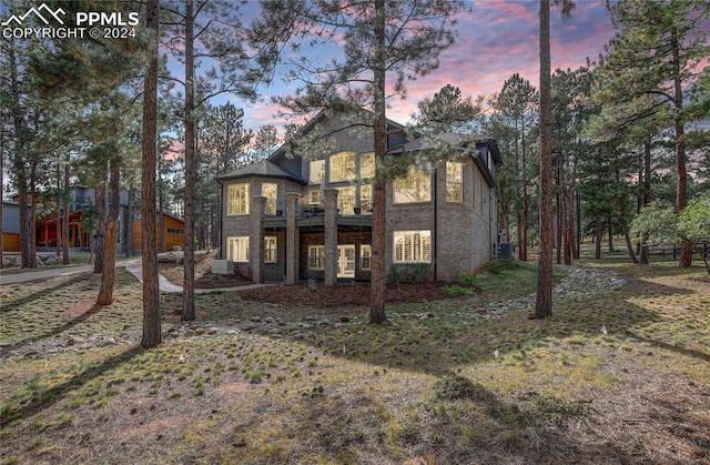 view of back house at dusk