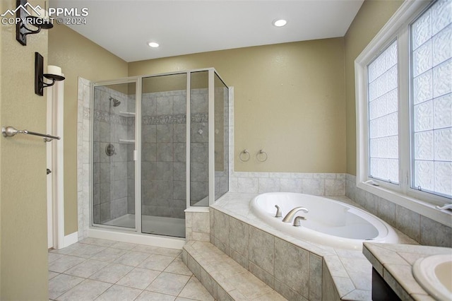 bathroom with vanity, tile patterned floors, and independent shower and bath