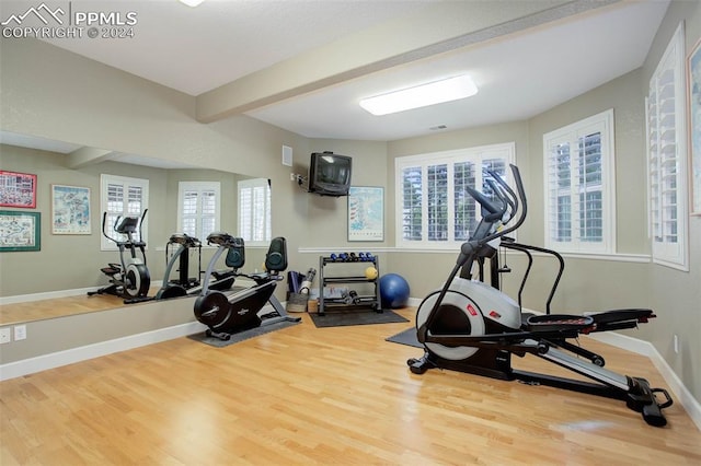 exercise area with hardwood / wood-style flooring