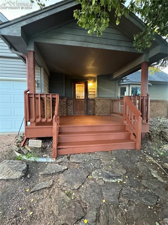 wooden deck featuring covered porch