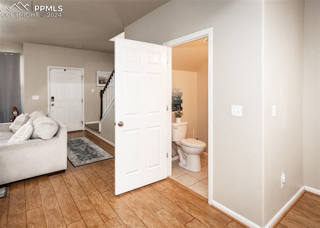 1441 Kempton Aly, Colorado Springs, CO 80910 - bathroom with wood finished floors, toilet, and baseboards
