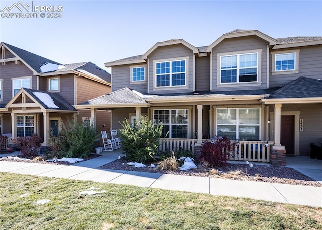 1441 Kempton Aly, Colorado Springs, CO 80910 - view of front of house featuring a porch and a front yard