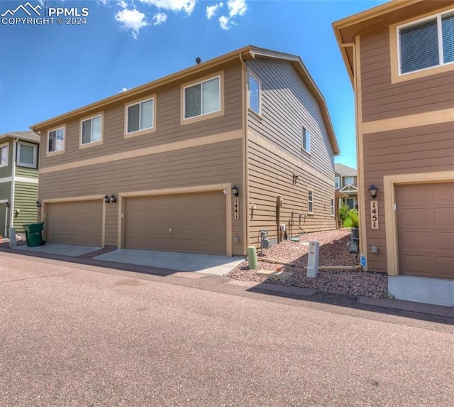 1441 Kempton Aly, Colorado Springs, CO 80910 - view of front of house featuring a garage